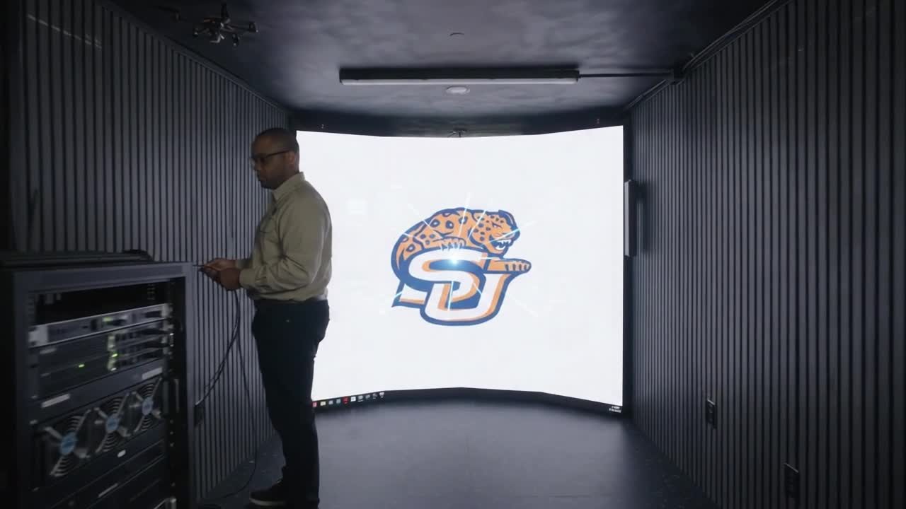 AI-made image of a person standing inside the Mobile CAVE in front of a curved screen with the Southern University logo